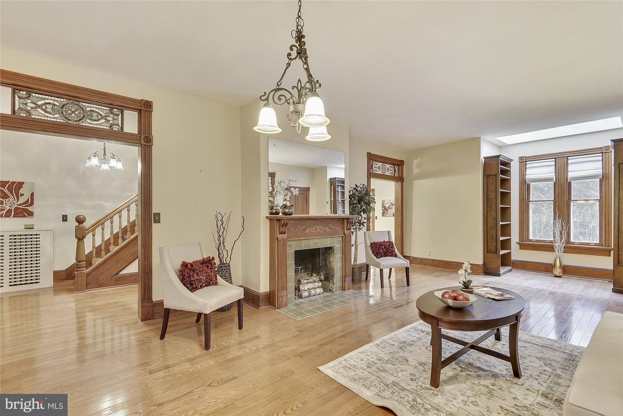 2200 Salisbury Road Silver Spring, MD 20910 - Photo 5 of 26 a living room with furniture a fireplace and a table