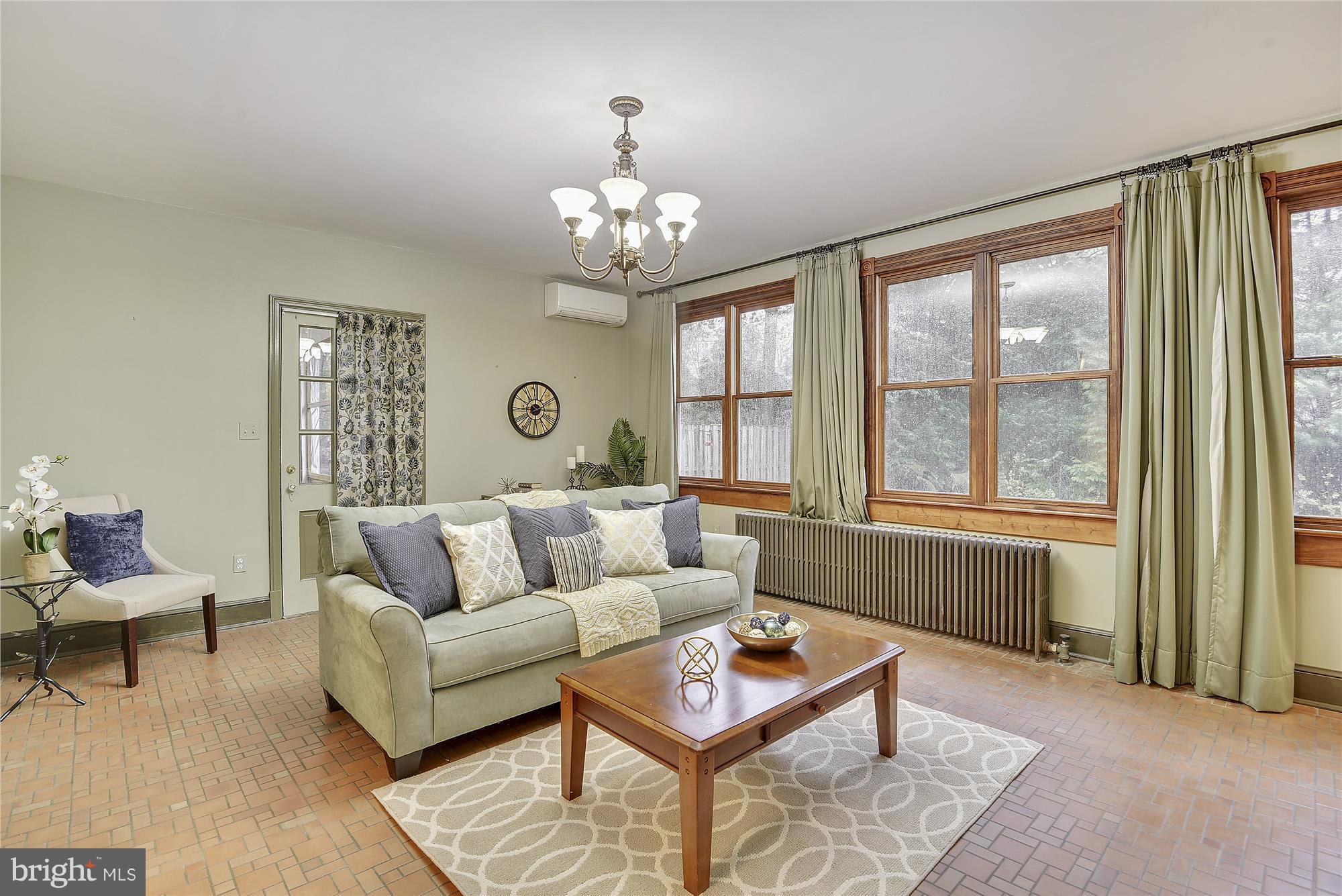 2200 Salisbury Road Silver Spring, MD 20910 - Photo 6 of 26 a living room with furniture and a chandelier