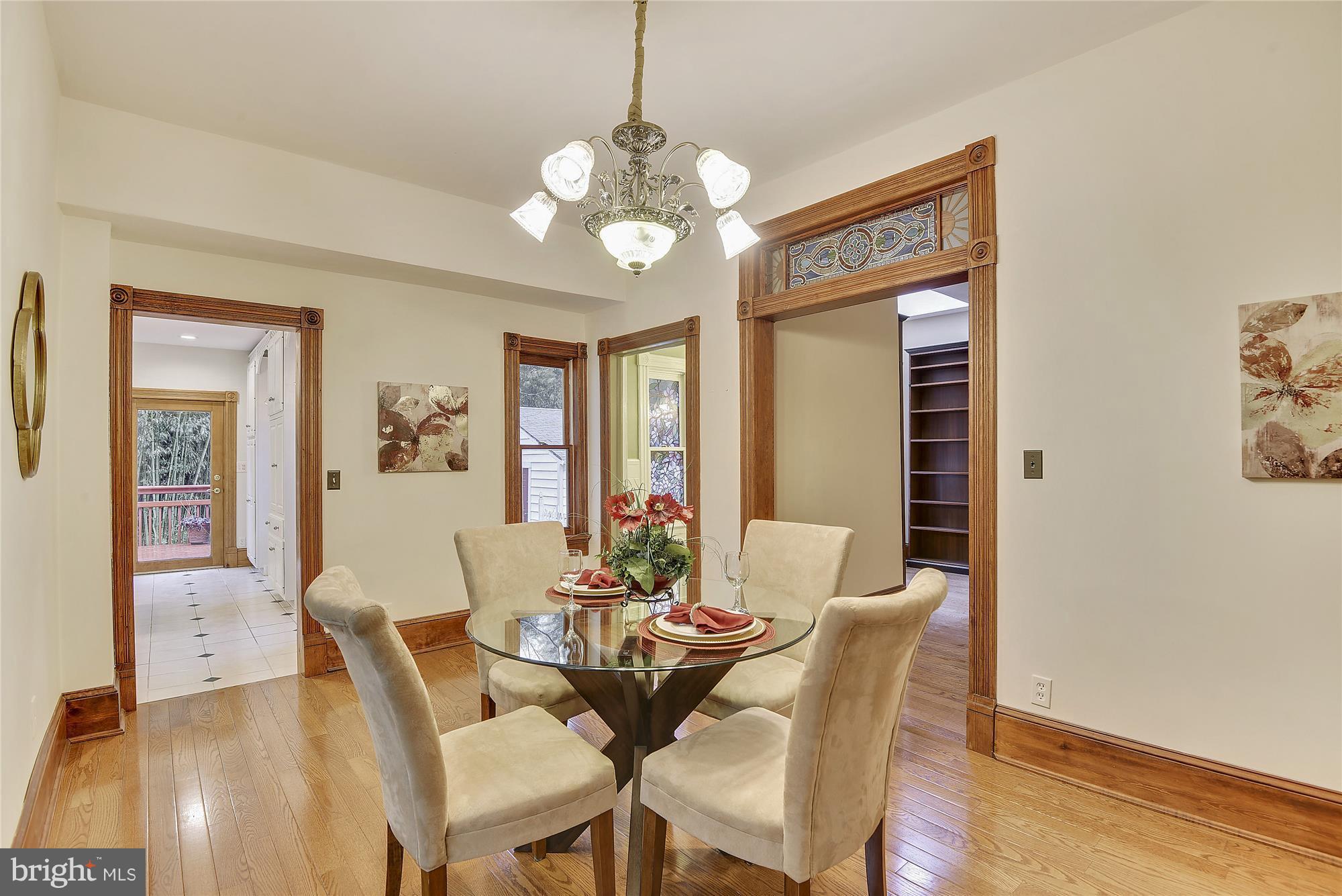 2200 Salisbury Road Silver Spring, MD 20910 - Photo 8 of 26 a view of a dining room with furniture and wooden floor