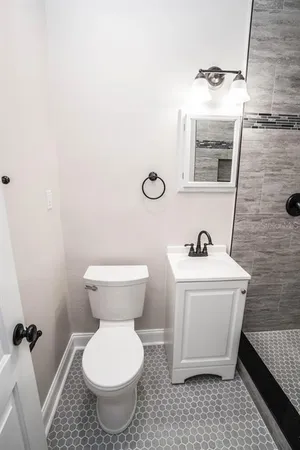 a bathroom with a toilet and a sink