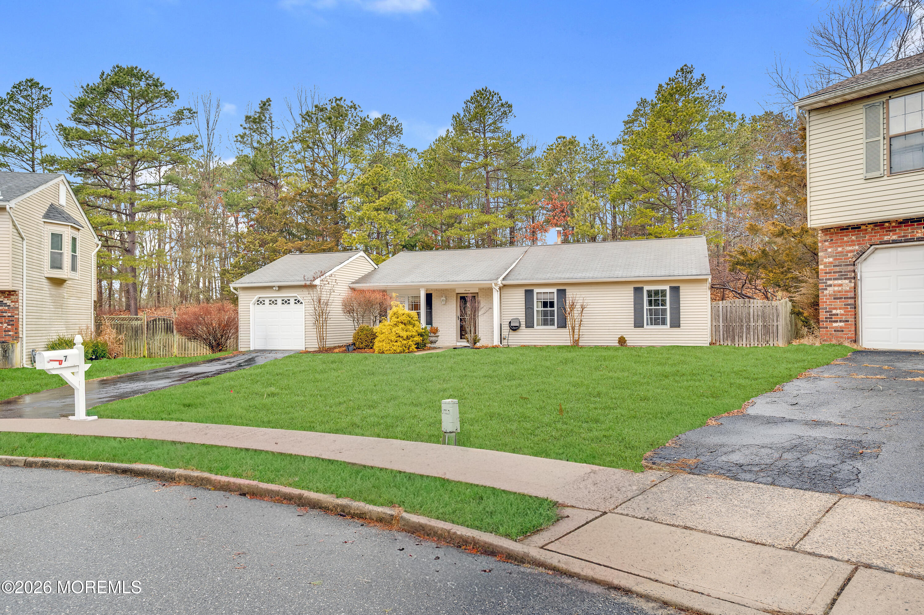 7 Deck Court Howell, NJ 07731 - Photo 15 of 29 a aerial view of a house next to a big yard and large trees