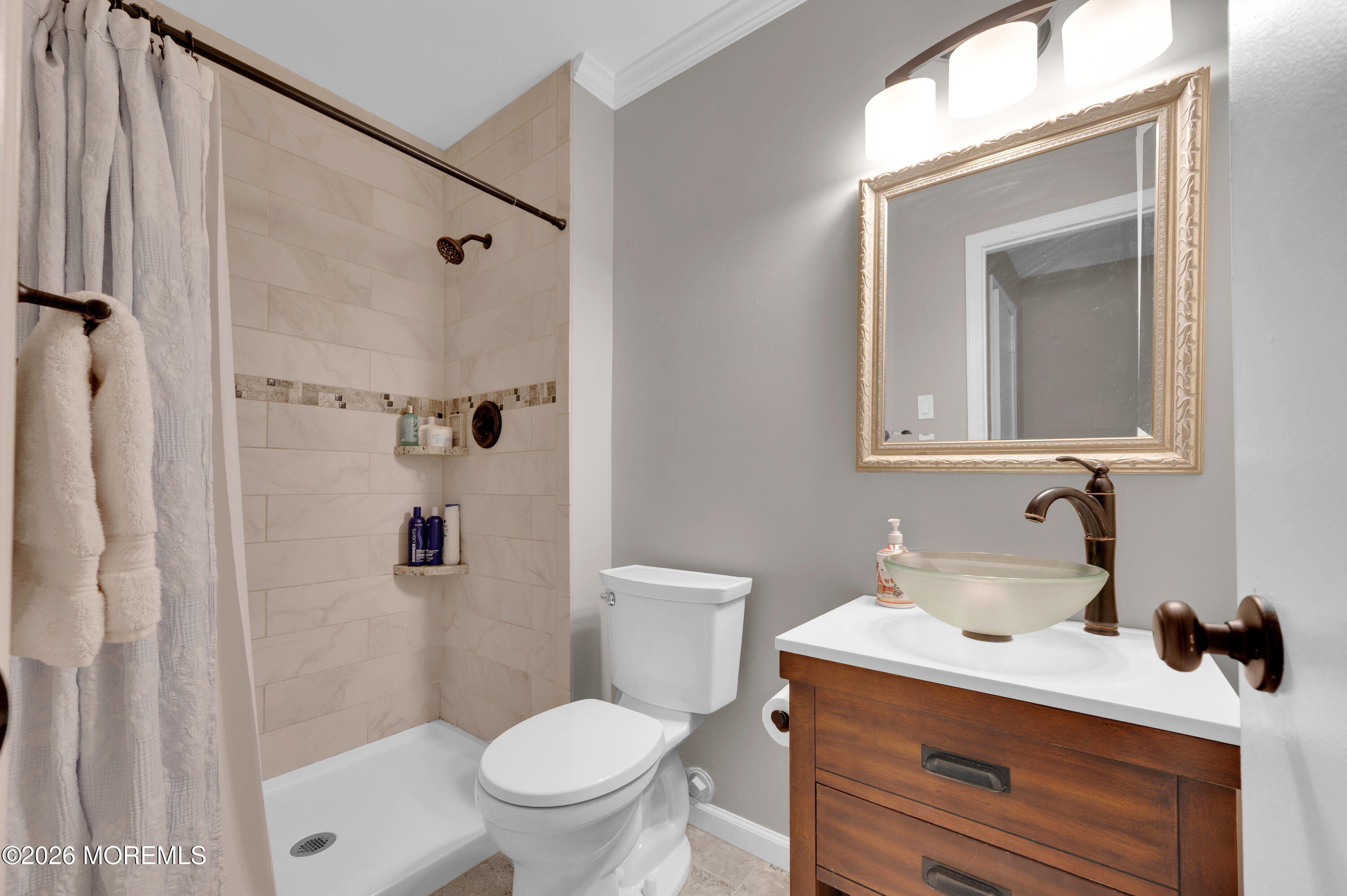 7 Deck Court Howell, NJ 07731 - Photo 22 of 29 a bathroom with a sink toilet and shower