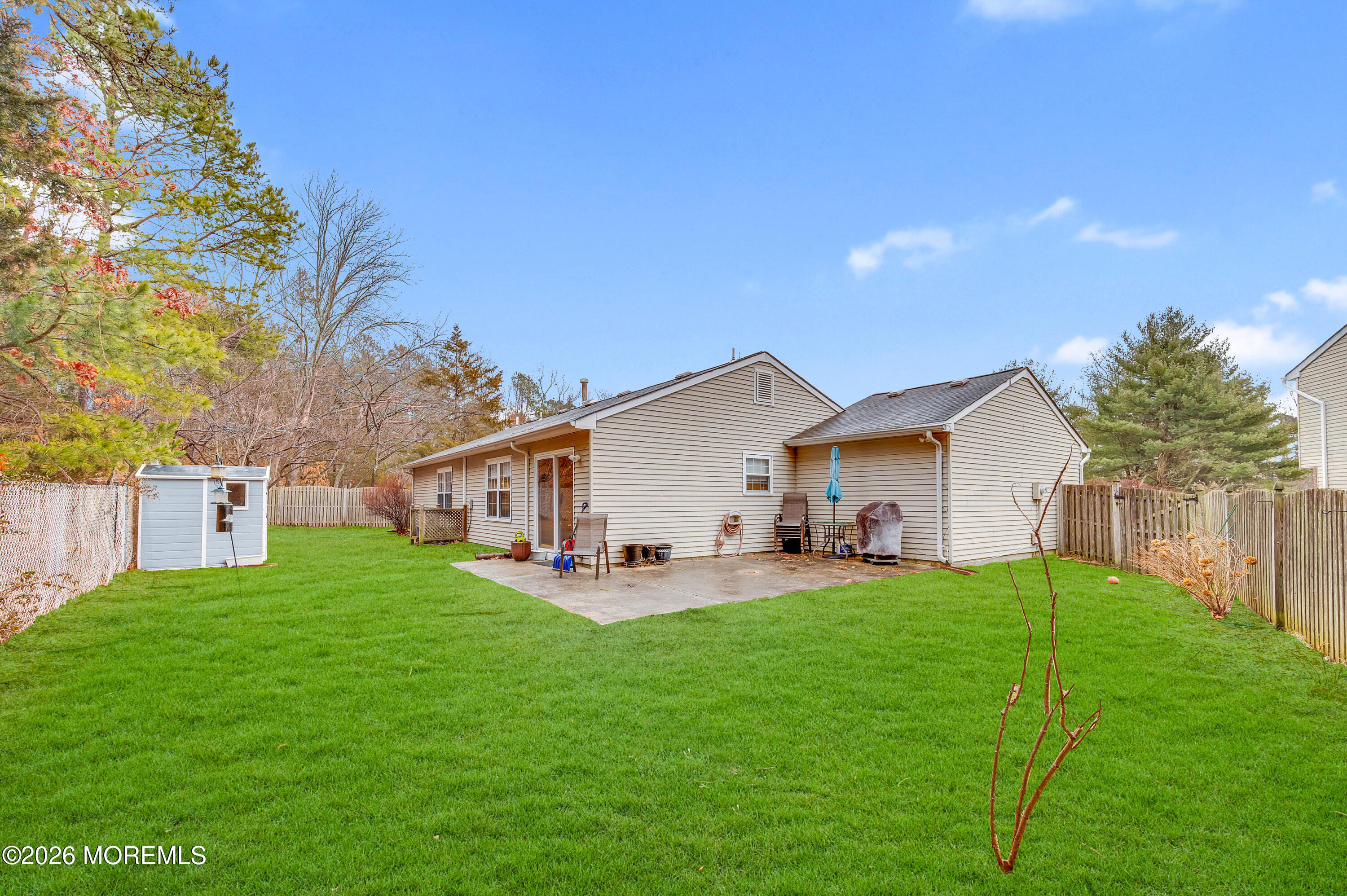7 Deck Court Howell, NJ 07731 - Photo 23 of 29 a house view with a sitting space and garden