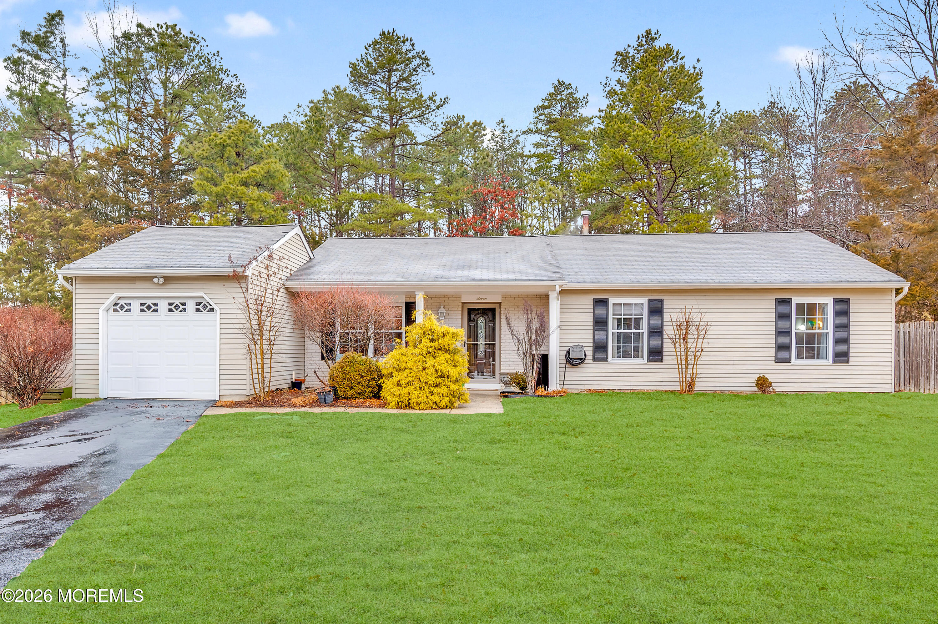 7 Deck Court Howell, NJ 07731 - Photo 27 of 29 a front view of a house with a yard and garage