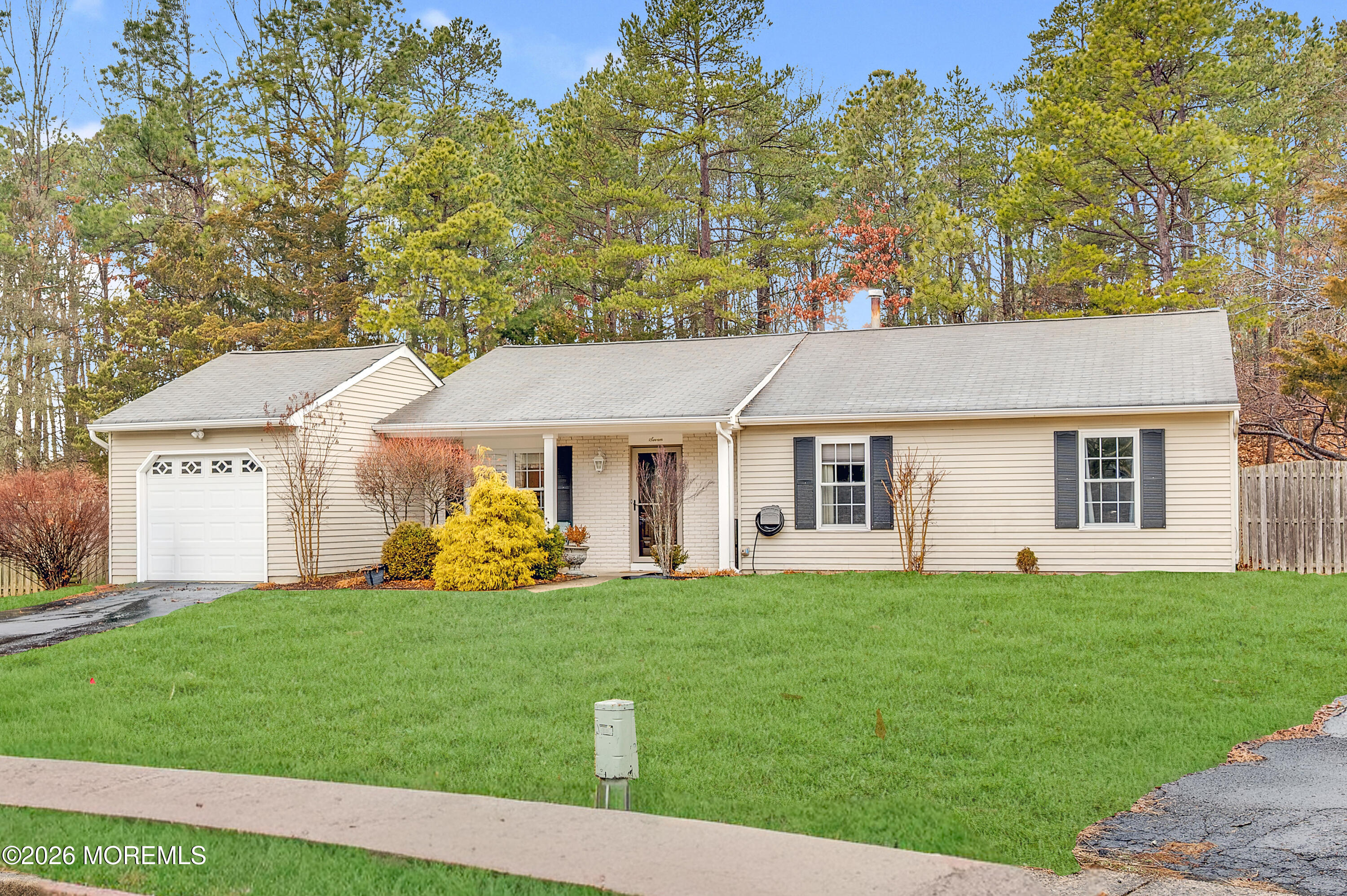 7 Deck Court Howell, NJ 07731 - Photo 28 of 29 a front view of a house with yard and green space