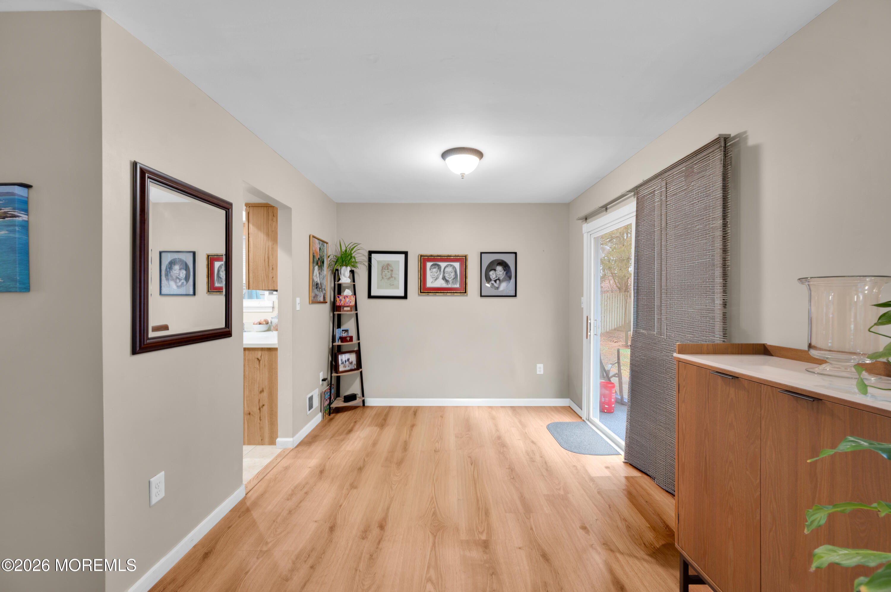 7 Deck Court Howell, NJ 07731 - Photo 7 of 29 a view of a room with wooden floor and a window