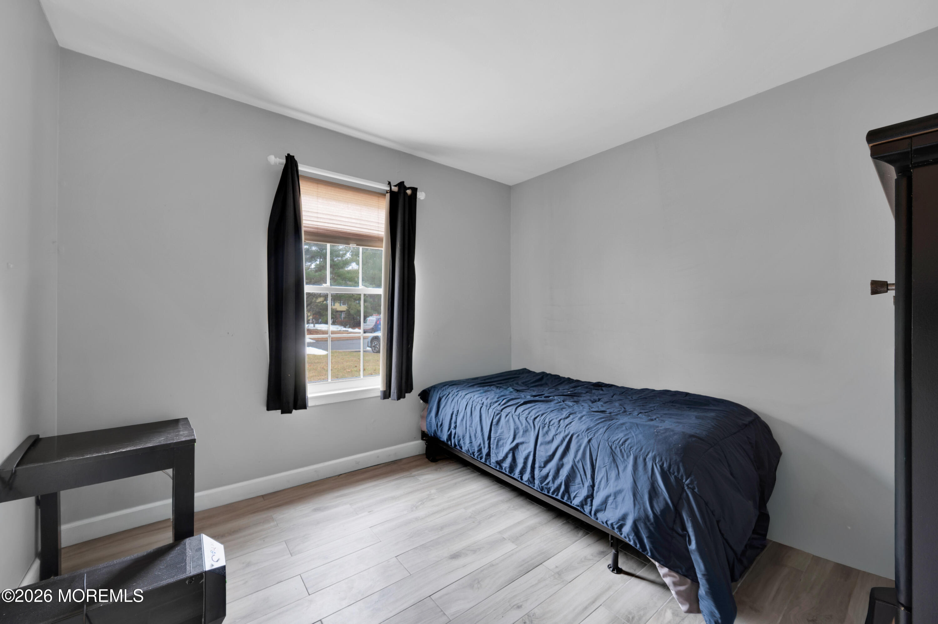 7 Deck Court Howell, NJ 07731 - Photo 8 of 29 a bedroom with a bed and window