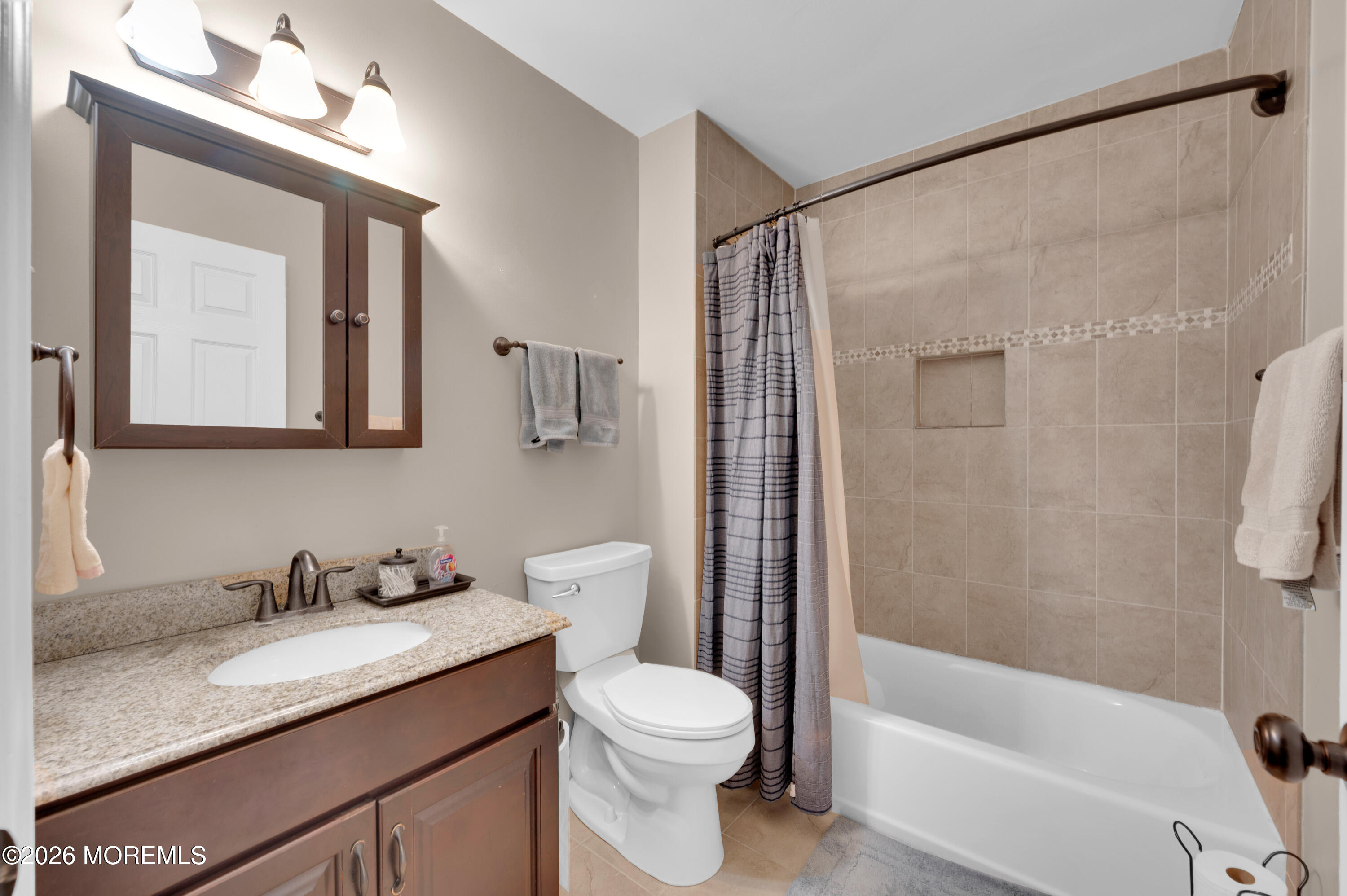 7 Deck Court Howell, NJ 07731 - Photo 9 of 29 a bathroom with a granite countertop sink toilet and shower