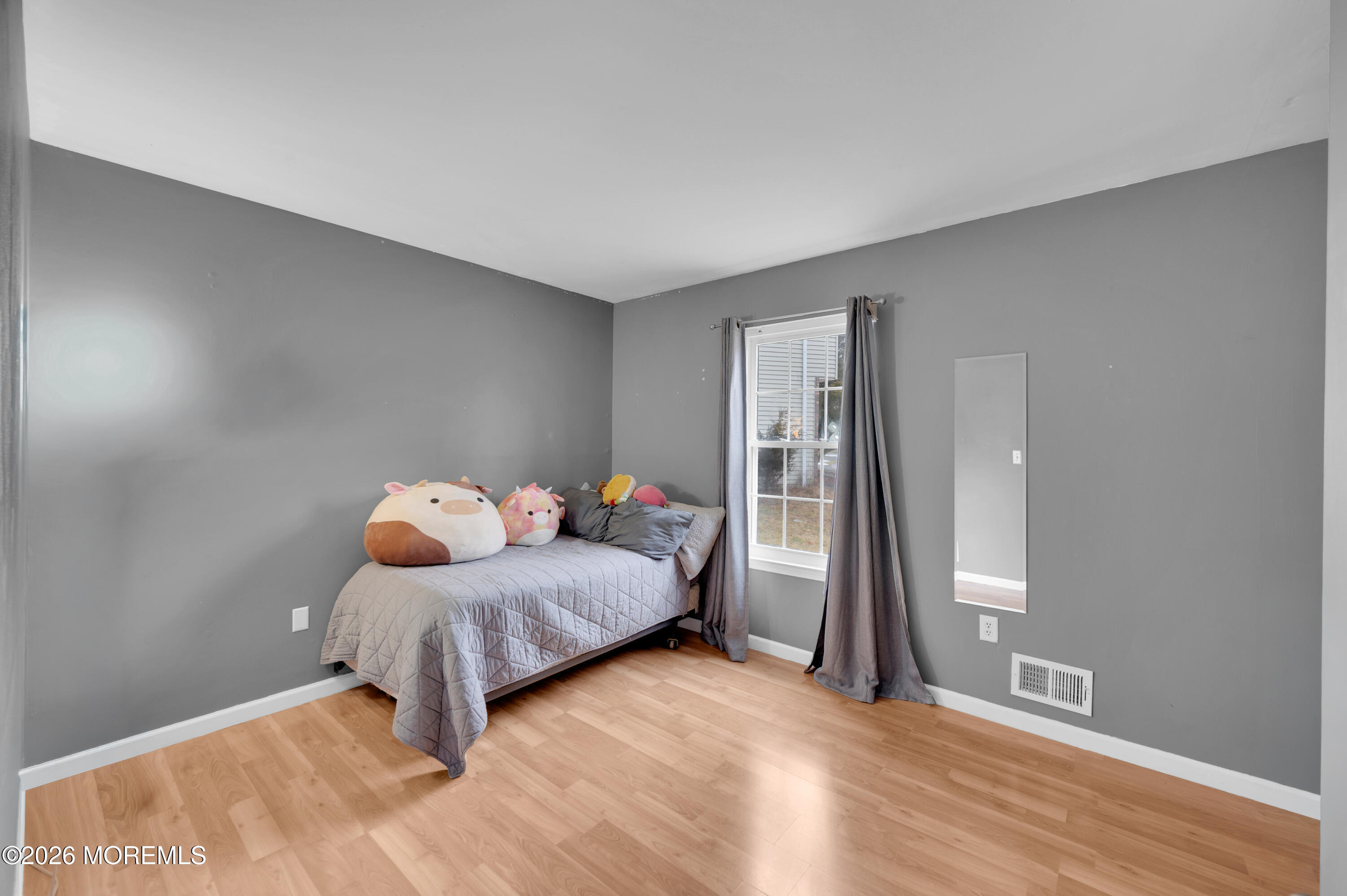 7 Deck Court Howell, NJ 07731 - Photo 10 of 29 a living room with a bed furniture and a wooden floor