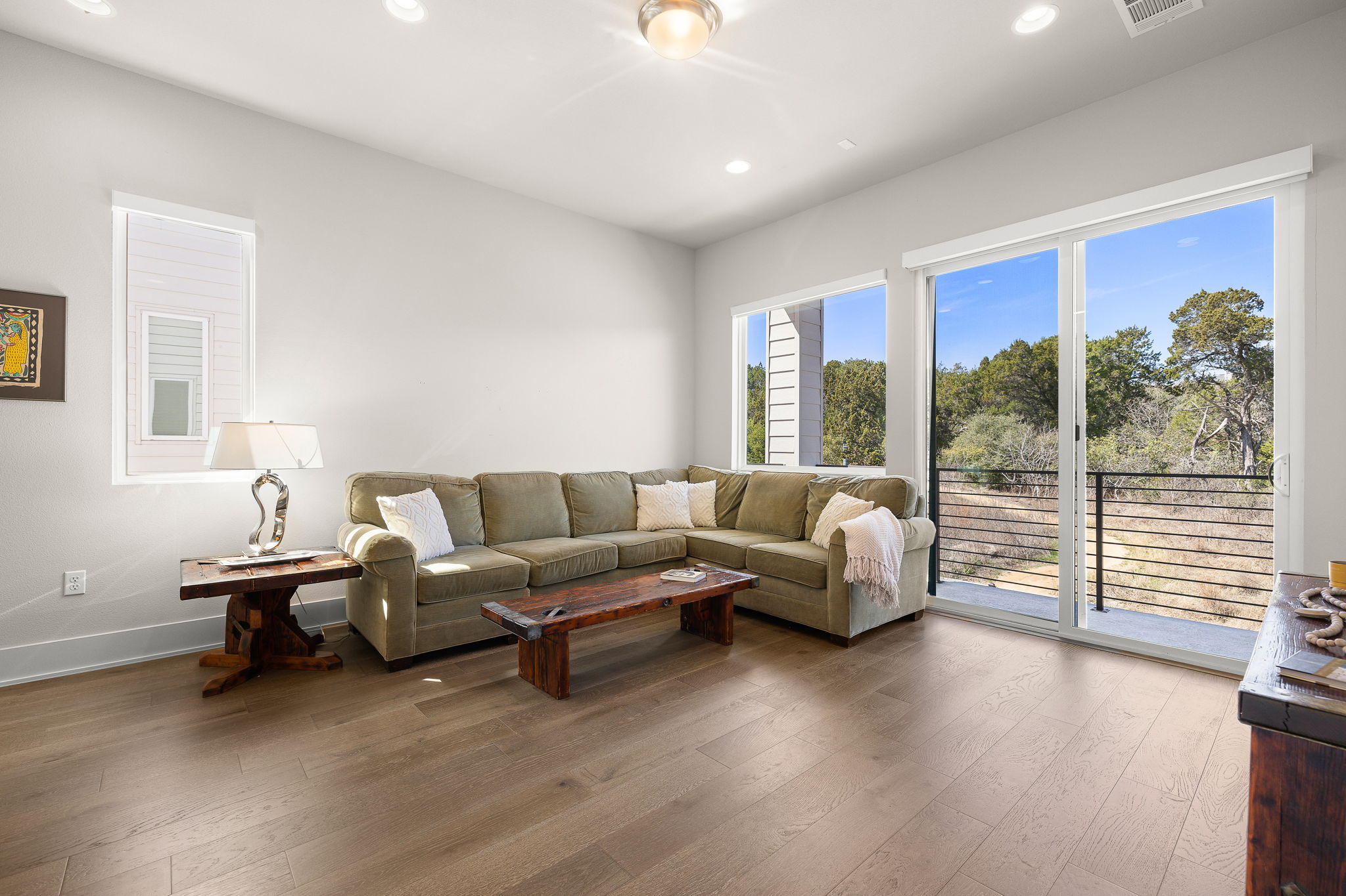 5214 Pink Poppy Pass Austin, TX 78735 - Photo 25 of 34 Living area featuring hardwood / wood-style floors and recessed lighting