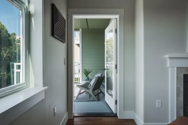 a view of a balcony with chairs