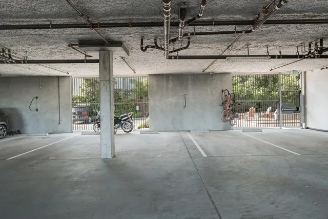 a view of a chairs and table in the back yard of the house
