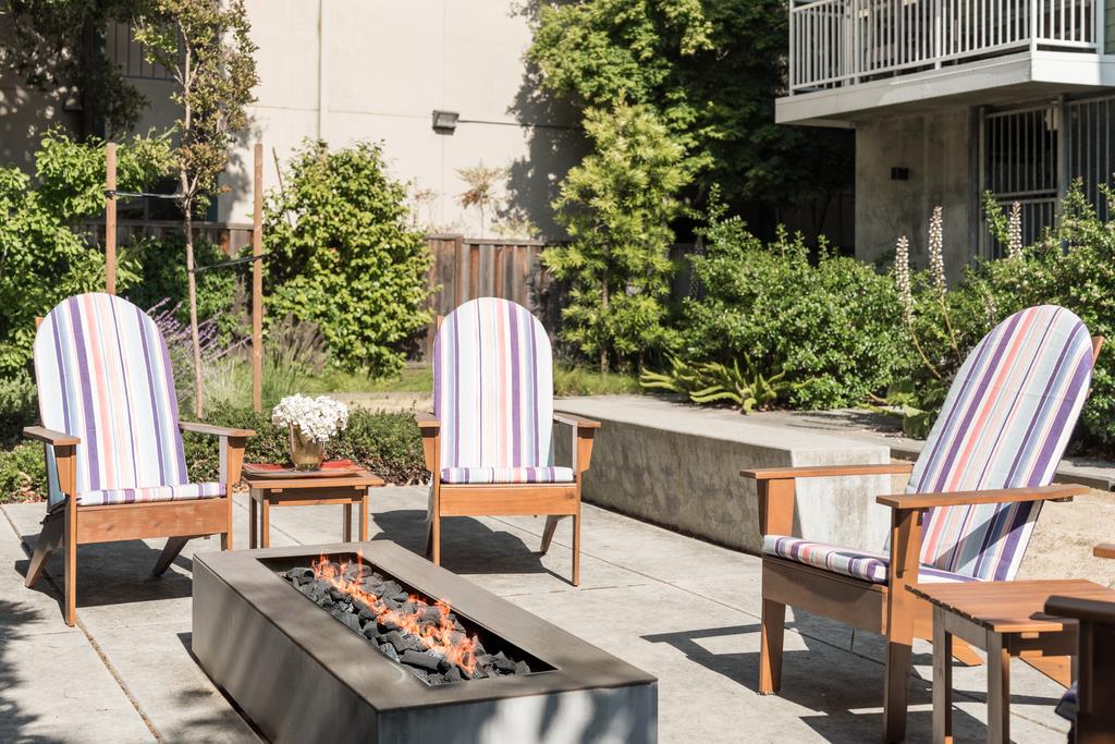 708 Frederick Street, Unit 204 Santa Cruz, CA 95062 - Photo 31 of 34 a view of outdoor sitting area with furniture and wooden fence