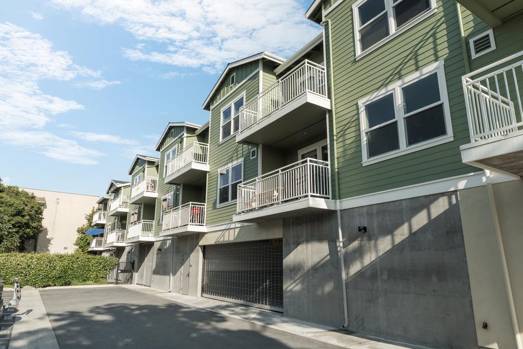 708 Frederick Street, Unit 204 Santa Cruz, CA 95062 - Photo 32 of 34 a front view of a building with balcony