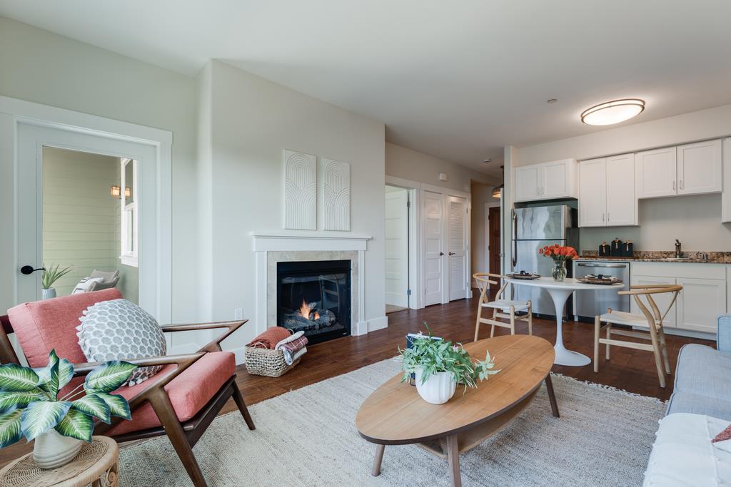 708 Frederick Street, Unit 204 Santa Cruz, CA 95062 - Photo 10 of 34 a living room with furniture fireplace and table