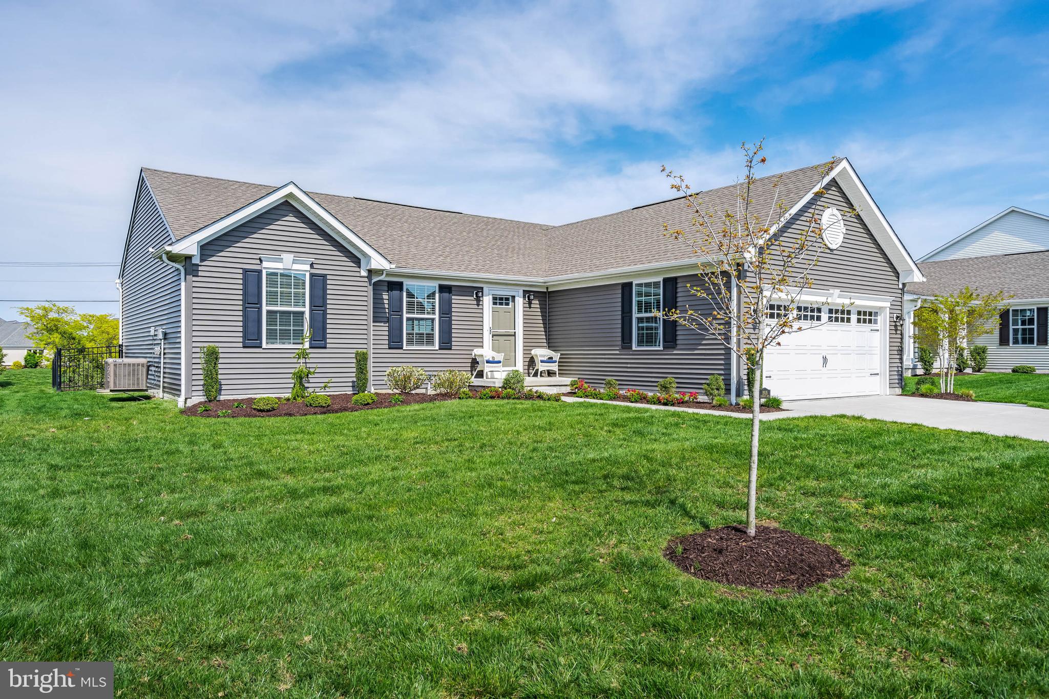 19016 Trimaran Drive Lewes, DE 19958 - Photo 2 of 44 a backyard of a house with table and chairs