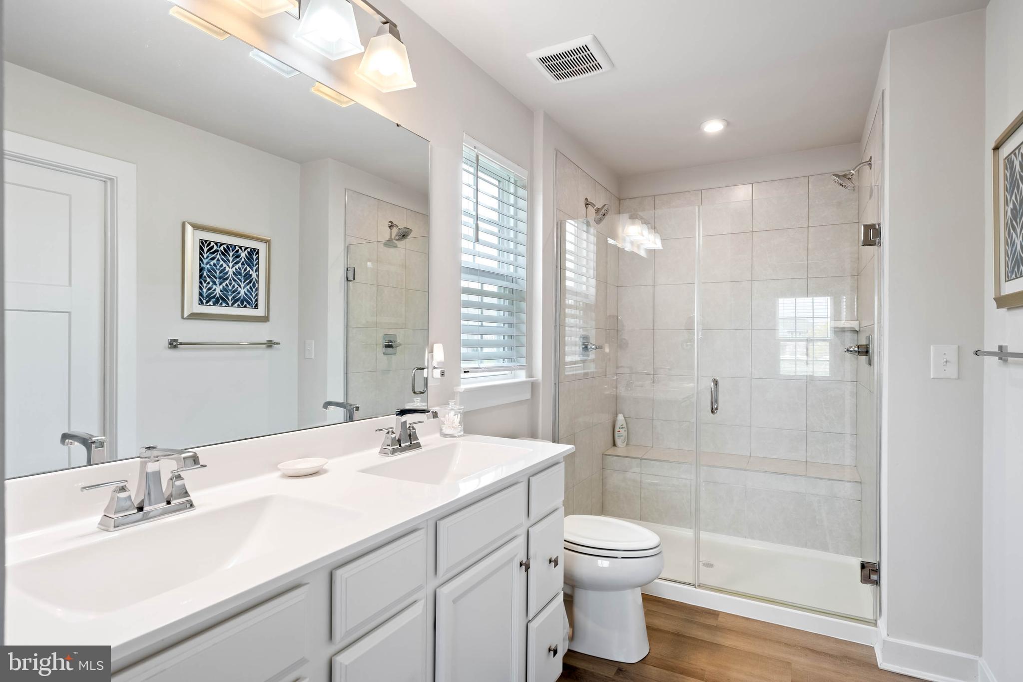 19016 Trimaran Drive Lewes, DE 19958 - Photo 21 of 44 a bathroom with a sink toilet and shower