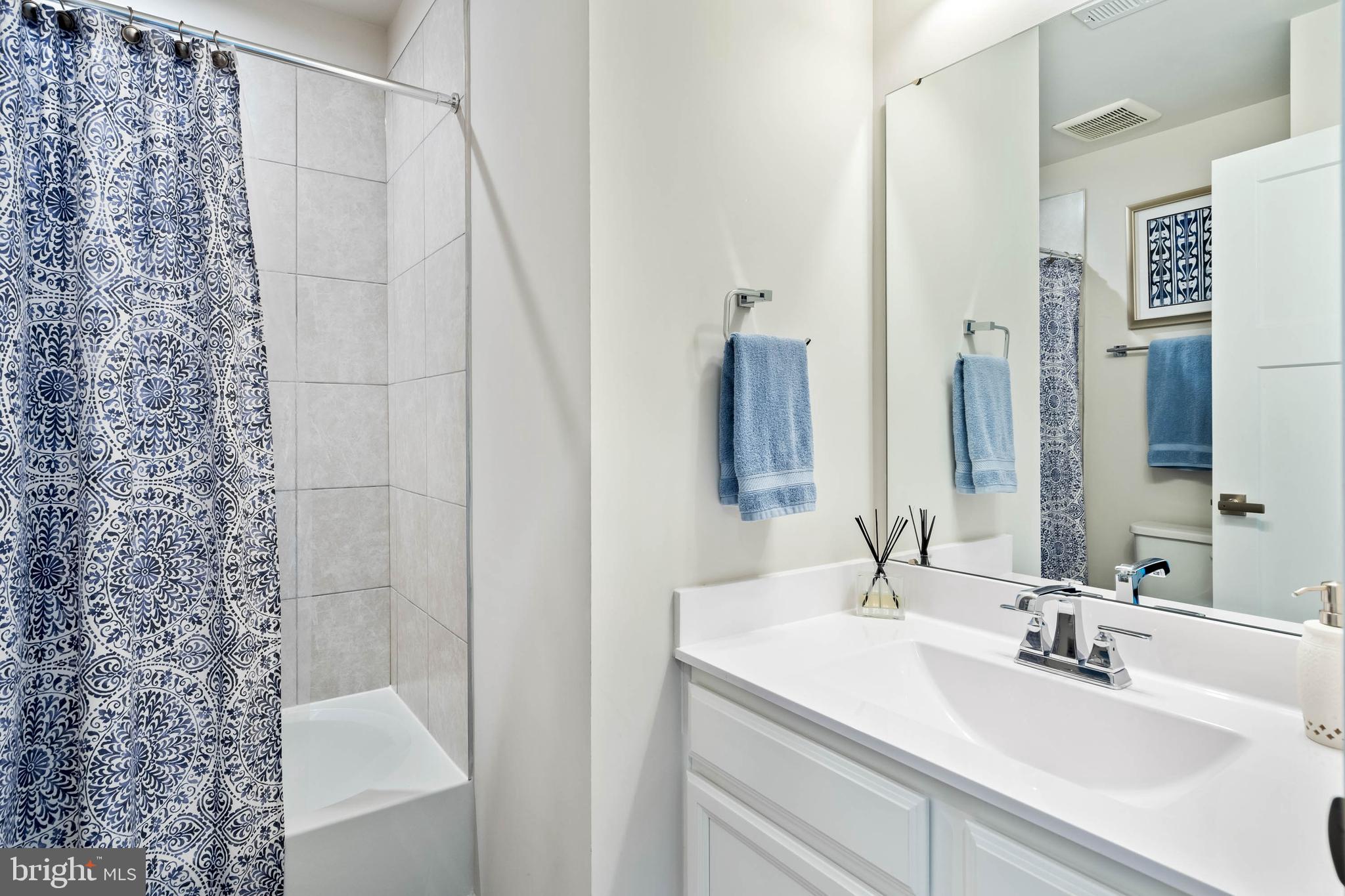 19016 Trimaran Drive Lewes, DE 19958 - Photo 26 of 44 a bathroom with a sink and a mirror