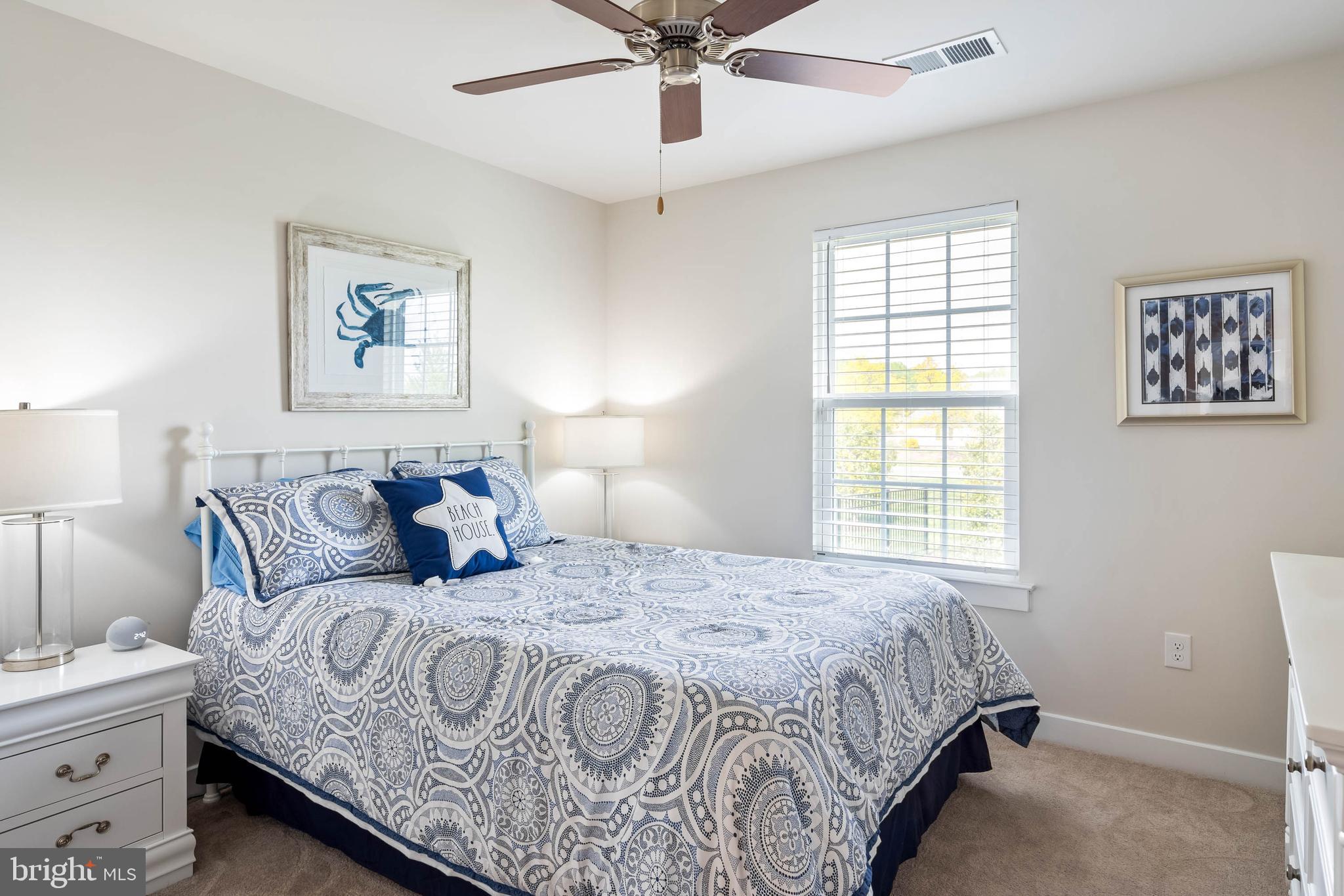 19016 Trimaran Drive Lewes, DE 19958 - Photo 27 of 44 a bedroom with bed and window