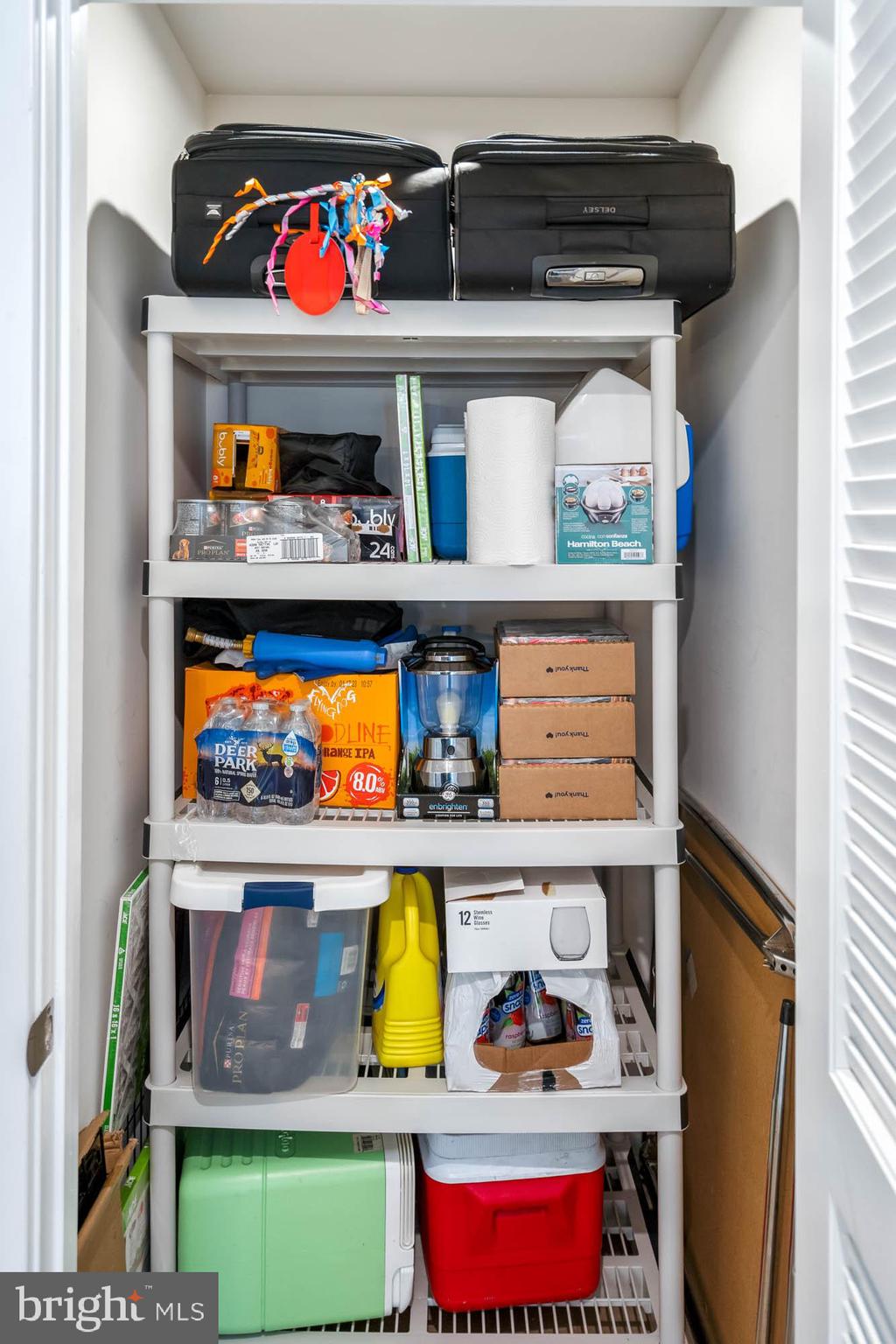 19016 Trimaran Drive Lewes, DE 19958 - Photo 29 of 44 a utility room with lots of different colored cloths