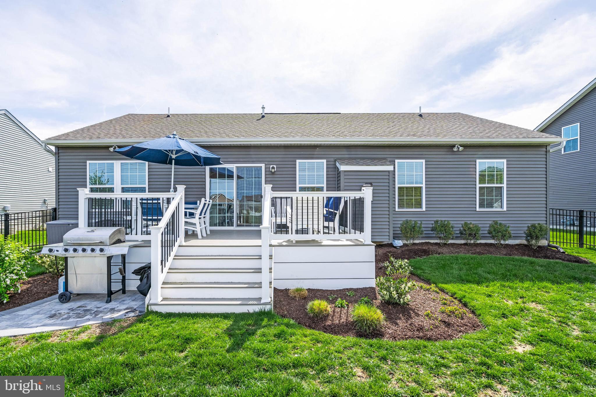 19016 Trimaran Drive Lewes, DE 19958 - Photo 33 of 44 a front view of a house with a yard