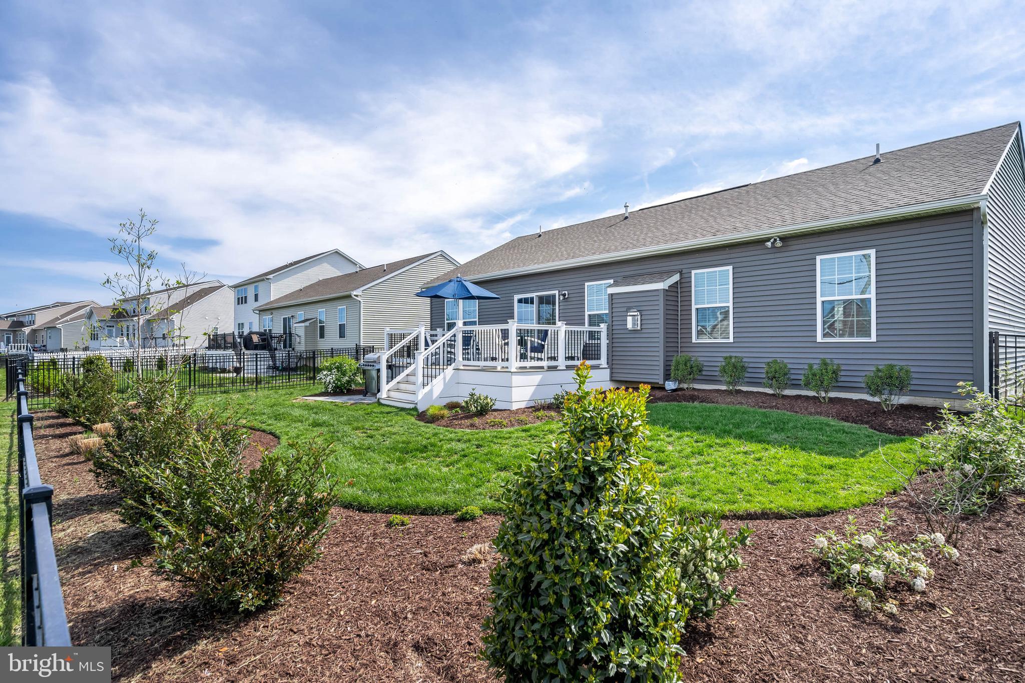 19016 Trimaran Drive Lewes, DE 19958 - Photo 35 of 44 a front view of a house with a yard