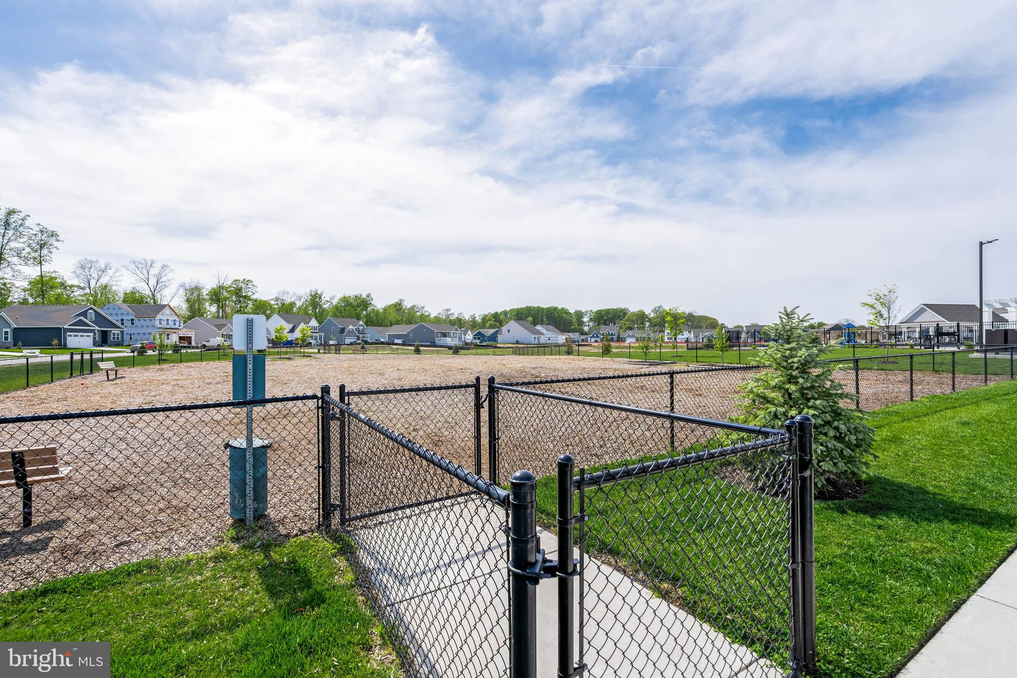 19016 Trimaran Drive Lewes, DE 19958 - Photo 42 of 44 a view of a pathway with a wrought fence
