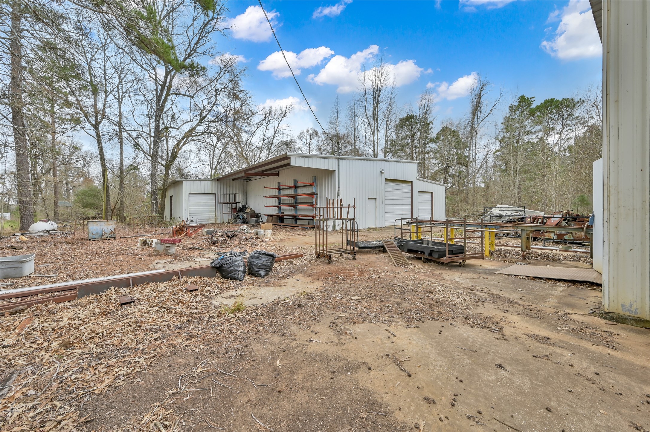 480 Bowling Road Point Blank, TX 77364 - Photo 18 of 23 a view of a house with backyard and sitting area