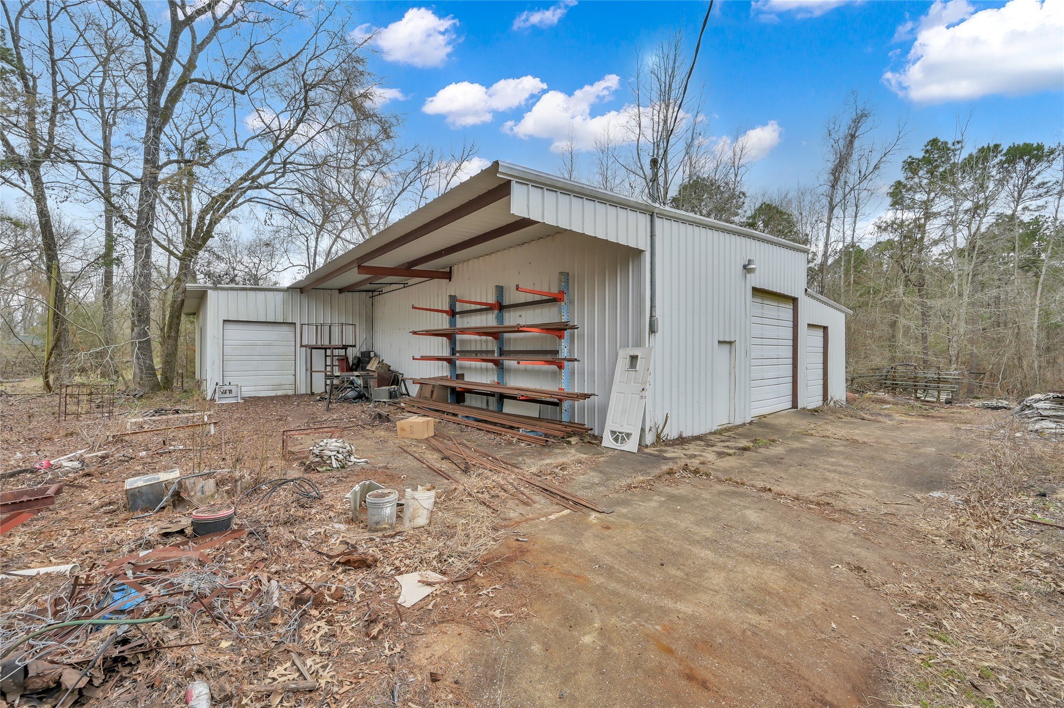 480 Bowling Road Point Blank, TX 77364 - Photo 19 of 23 a view of a house with a yard and garage