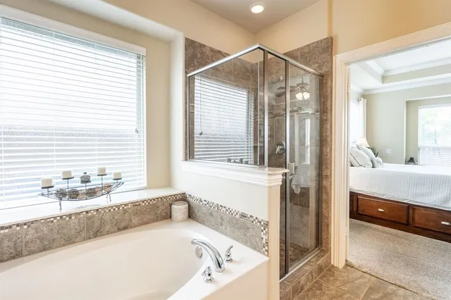 a spacious bathroom with a granite countertop sink and a mirror