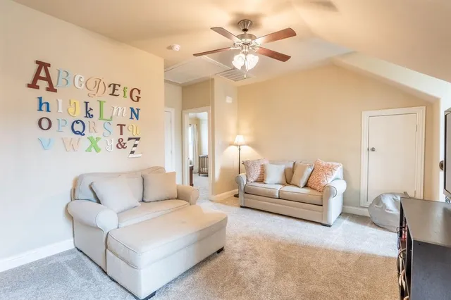 a bathroom with a tub a sink and a large window