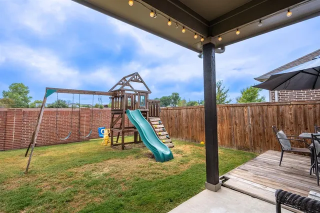 a view of a workspace with furniture and a chandelier fan