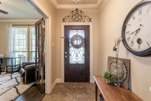 a view of a hallway with furniture and windows