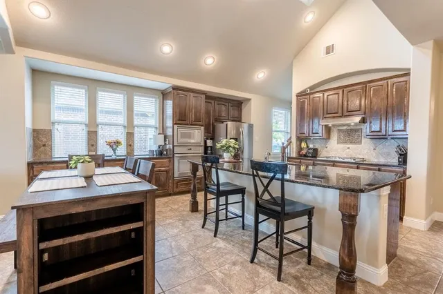 a balcony with furniture and wooden floor