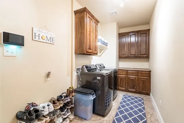 a dining hall with stainless steel appliances granite countertop a granite counter tops and a view of living room