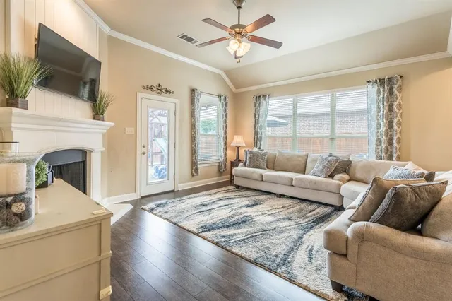 a bathroom with a sink mirror vanity and toilet