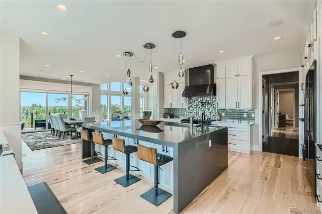a kitchen with stainless steel appliances granite countertop a stove oven and a refrigerator