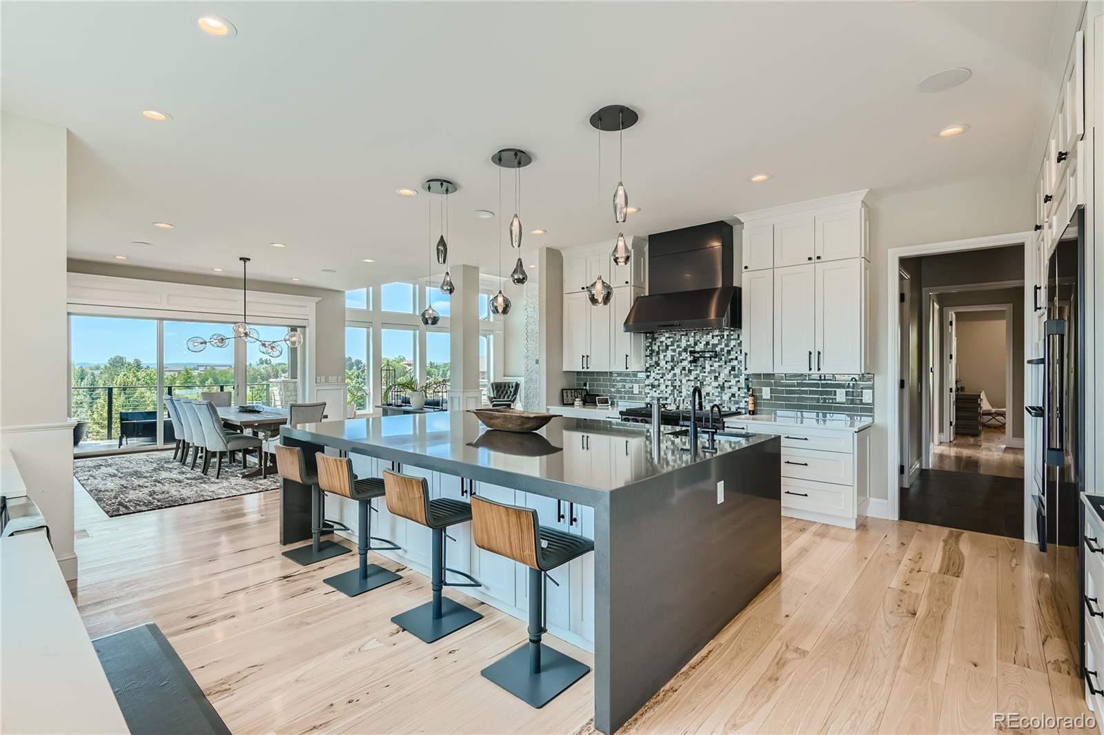 1757 Whistlepig Lane Broomfield, CO 80020 - Photo 24 of 50 a kitchen with stainless steel appliances granite countertop a stove oven and a refrigerator