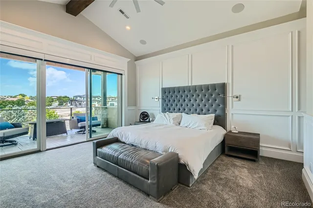 a bedroom with a bed couch and window