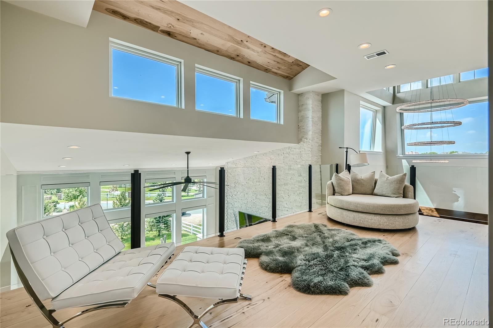 1757 Whistlepig Lane Broomfield, CO 80020 - Photo 32 of 50 a living room with furniture and a large window