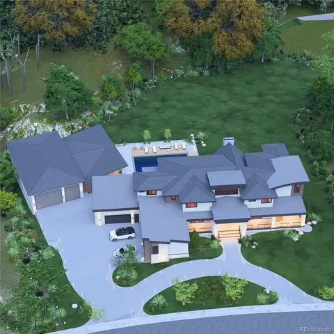 an aerial view of residential houses with outdoor space and lake view