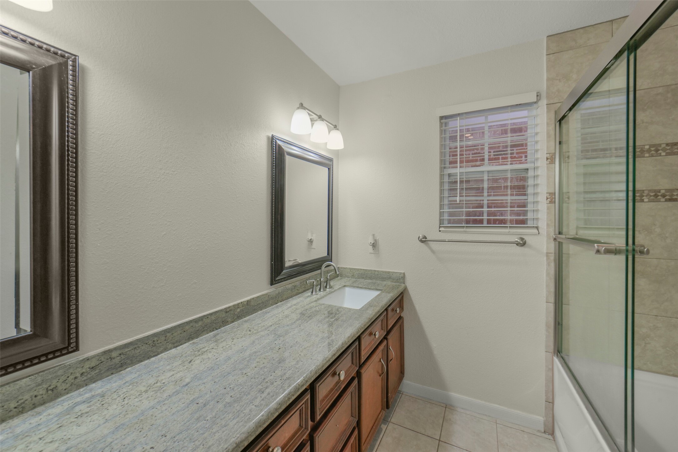 5707 Innsbruck Street Bellaire, TX 77401 - Photo 25 of 35 Upgraded granite countertops with dual vanities.