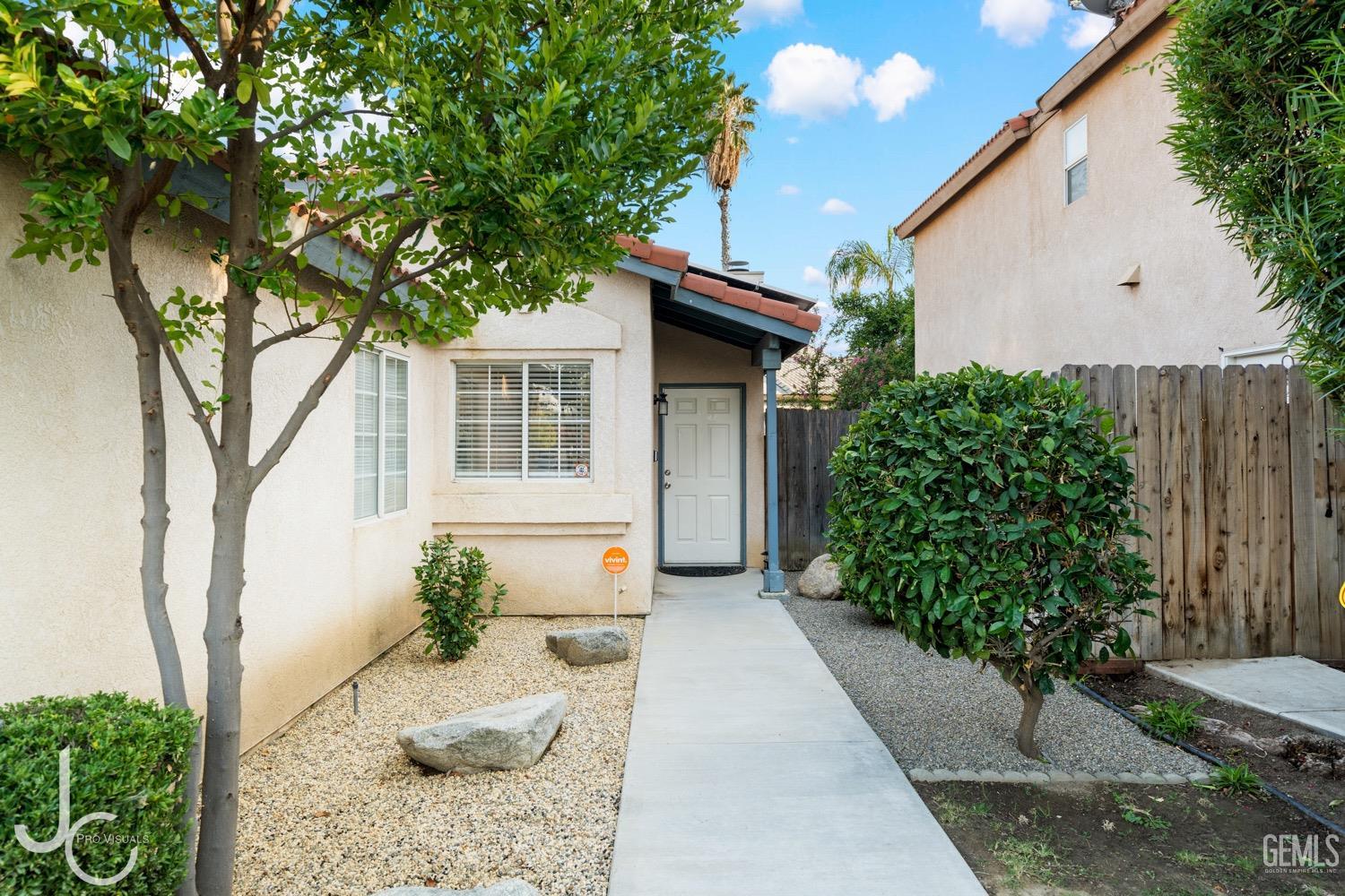 Undisclosed Address Bakersfield, CA 93311 - Photo 2 of 20 a front view of a house with garden