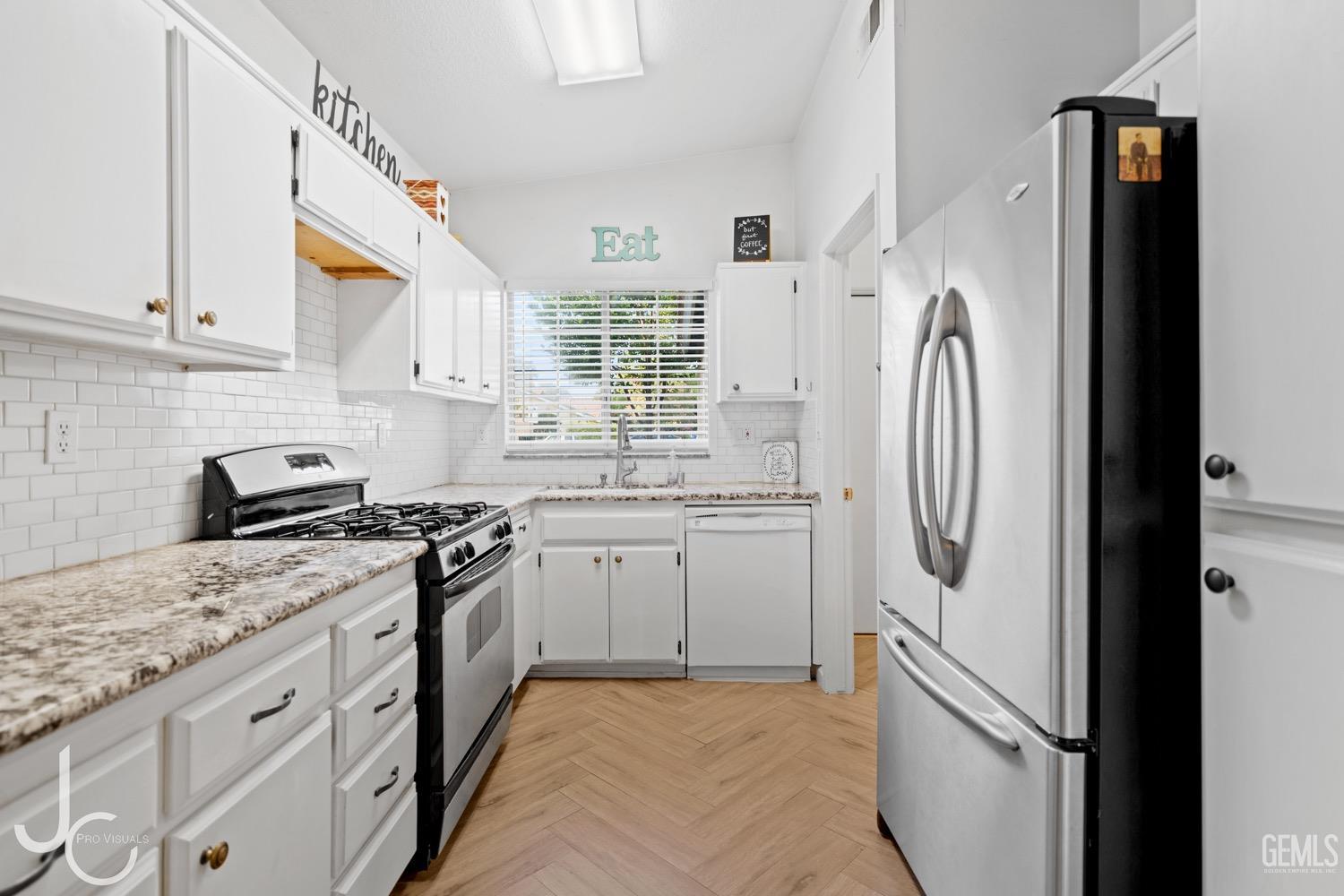 Undisclosed Address Bakersfield, CA 93311 - Photo 8 of 20 a kitchen with stainless steel appliances granite countertop a refrigerator sink and stove