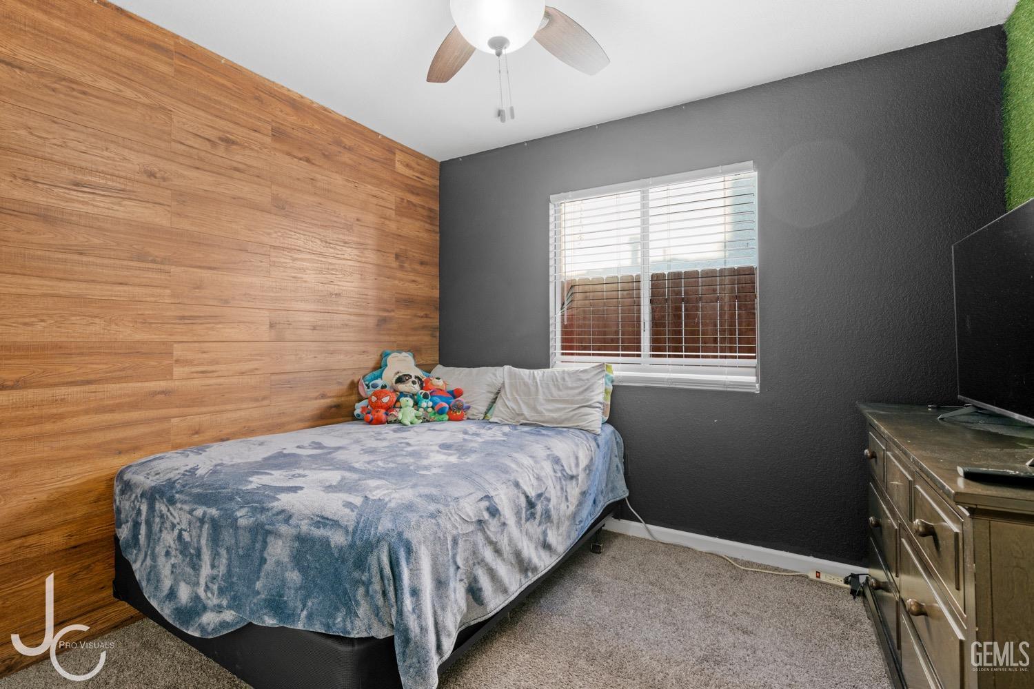 Undisclosed Address Bakersfield, CA 93311 - Photo 9 of 20 a bed sitting in a bedroom next to a window