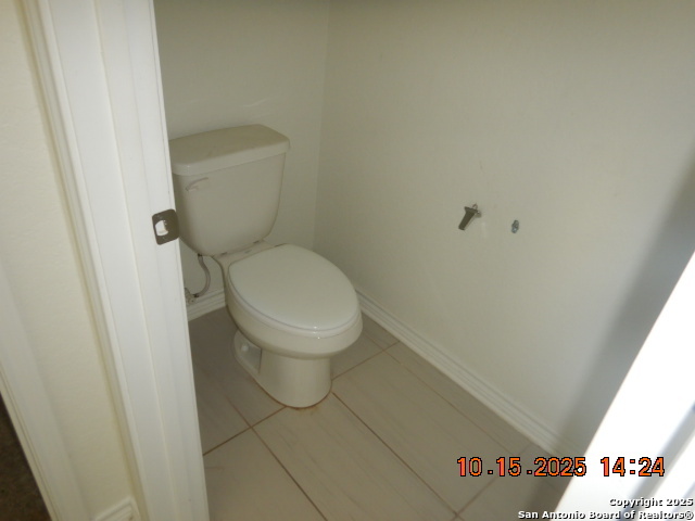 6555 Runaway Row Converse, TX 78109 - Photo 12 of 23 a white toilet sitting next to a shower
