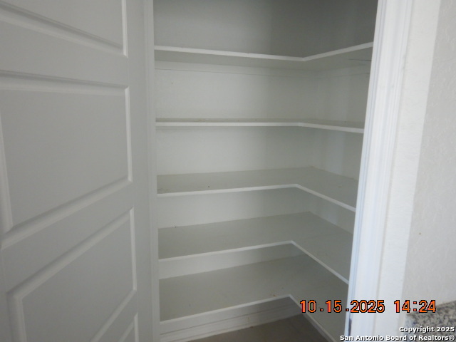 6555 Runaway Row Converse, TX 78109 - Photo 17 of 23 a view of walk in closet with empty racks