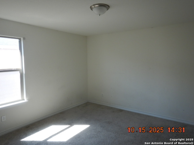 6555 Runaway Row Converse, TX 78109 - Photo 22 of 23 an empty room with a window
