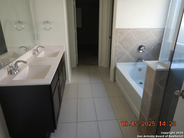 6555 Runaway Row Converse, TX 78109 - Photo 10 of 23 a bathroom with a sink and a mirror