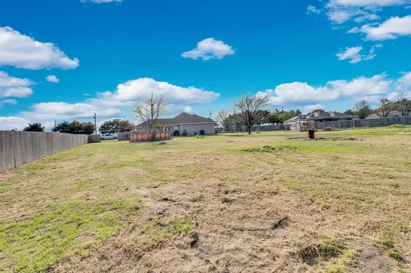 a view of a chairs and table in the balcony